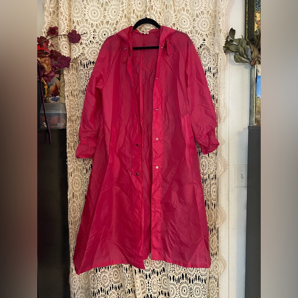 Vintage bright pink rain coat in fabulous condition.